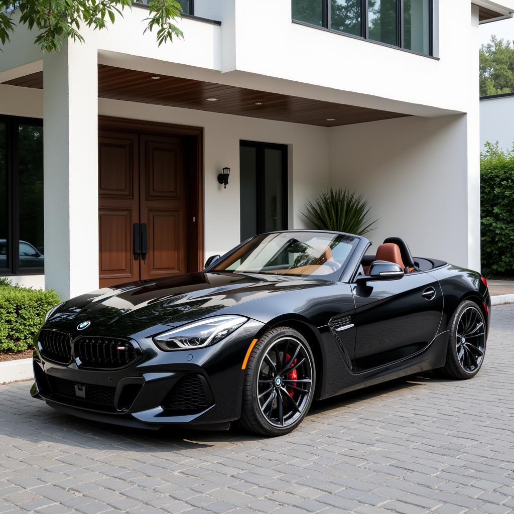 BMW Z4 màu đen sang trọng đậu trước một biệt thự hiện đại